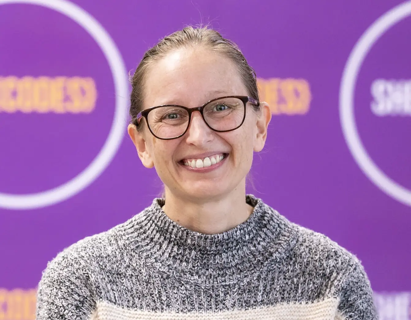 Gina's headshot with the purple SheCodes Australia banner in the background.
